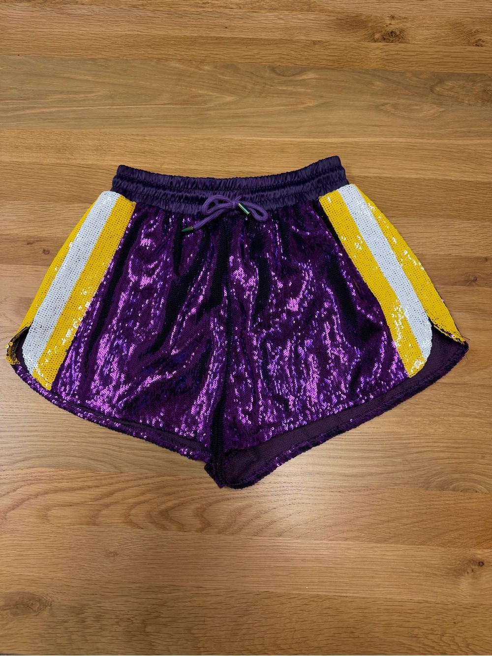 QUEEN OF SPARKLES Purple Sequin Athletic Shorts with Yellow & White Side Stripes